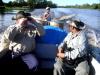 Brother Ken Yates, Brother Oliver Subryan, and out boat captain on our way to a church